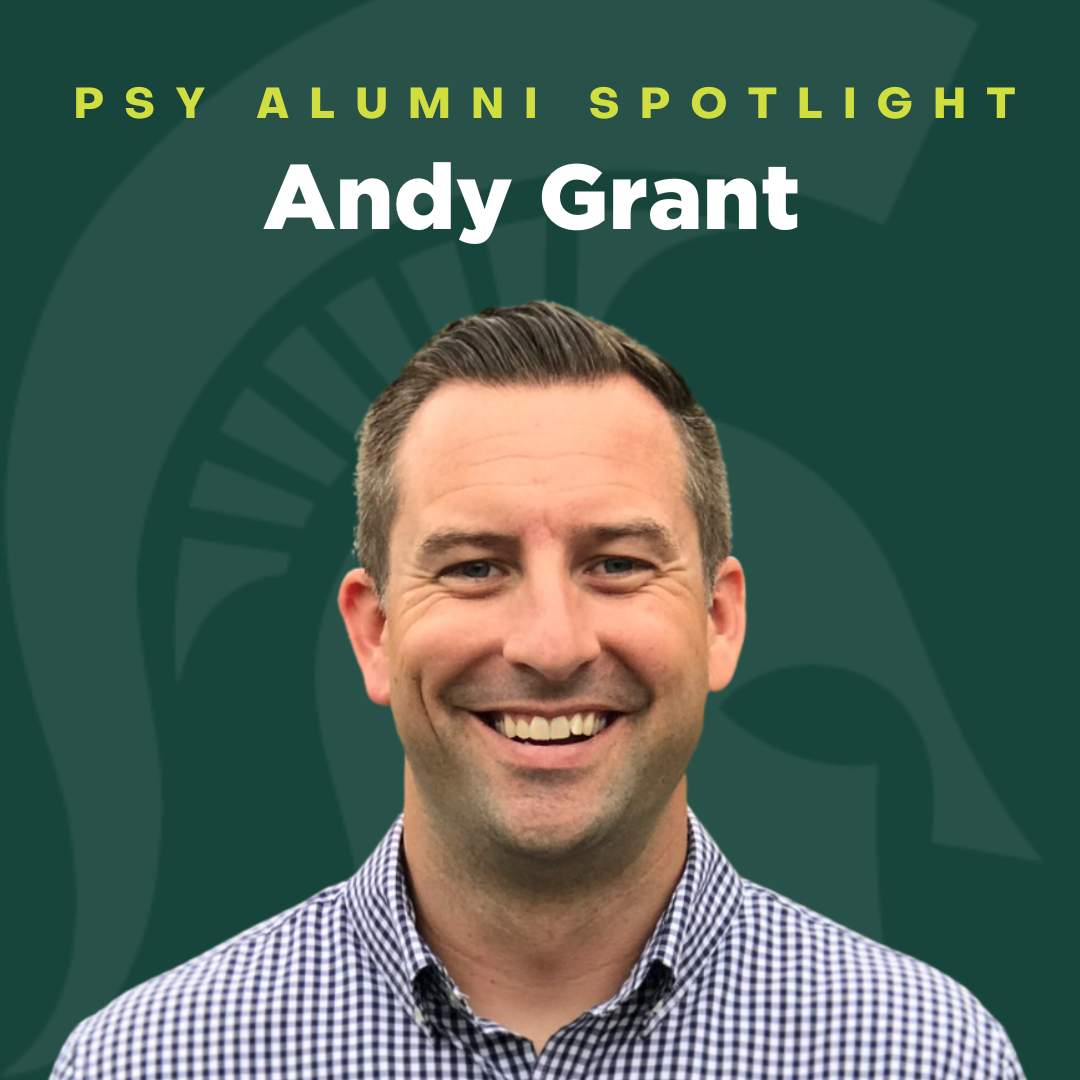 A green graphic with the MSU Spartan head in the background. In the foreground is a picture of Andy Grant smiling at the camera. The text says "PSY Alumni Spotlight Andy Grant"